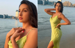 Nora Fatehi flaunts sexy curves in backless satin gown with a thigh high slit, Watch